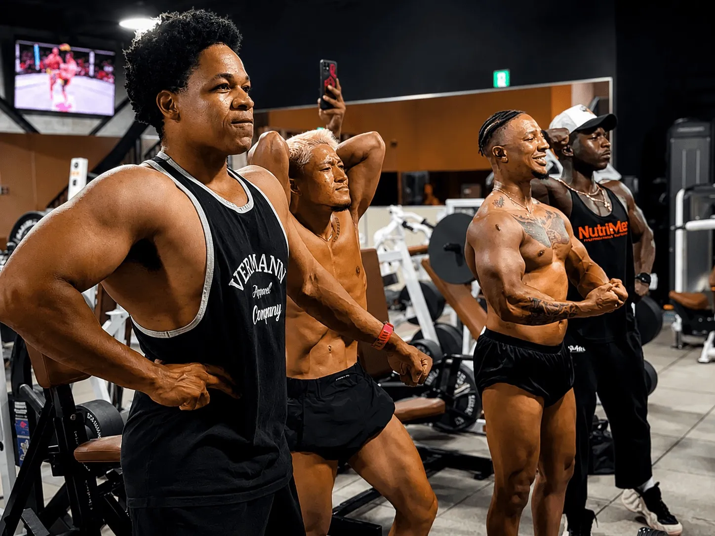 Members posing together in the posing room